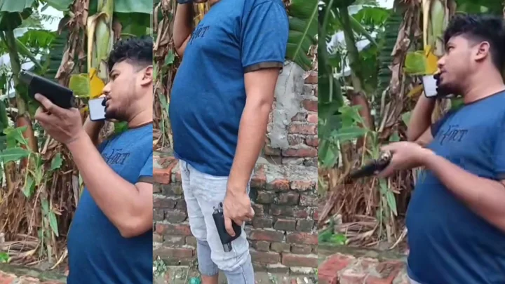 এক হাতে অস্ত্র নাড়ছেন, আরেক হাতে ফোন–ভাইরাল ভিডিওর ব্যক্তিটি কে